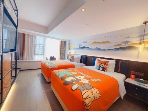 Katil atau katil-katil dalam bilik di Mehood Lestie Hotel Maoming High-speed Railway