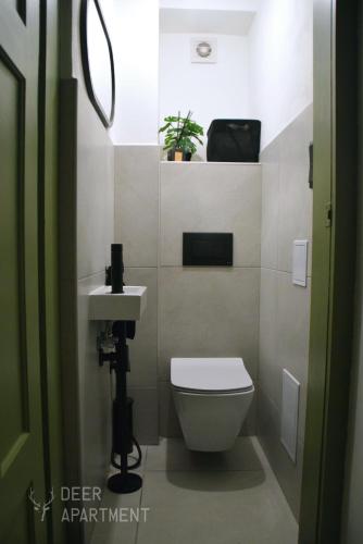 a bathroom with a toilet and a sink at Deer Apartment - exclusive apartment Jihlava in Jihlava
