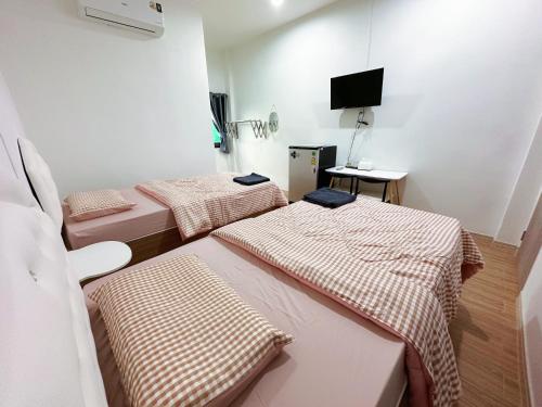 Voodi või voodid majutusasutuse Seamthong Resort เสียมทองรีสอร์ท toas