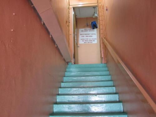 a staircase with blue steps in a building at Nilai H2 in Nilai
