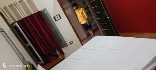 Postel nebo postele na pokoji v ubytování Ma Shavitri Guest House