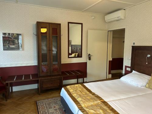 Postel nebo postele na pokoji v ubytování Hotel Boshof