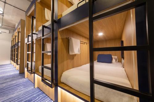 a row of bunk beds in a dorm room at Bluewaters Female-Only Hostel in Singapore