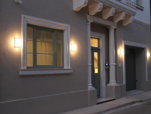 a building with a window on the side of it at North Lodge by PetitChic in Mellieħa