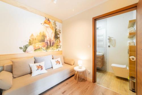 a room with a couch with pillows on it at DW Bogun in Białka Tatrzanska