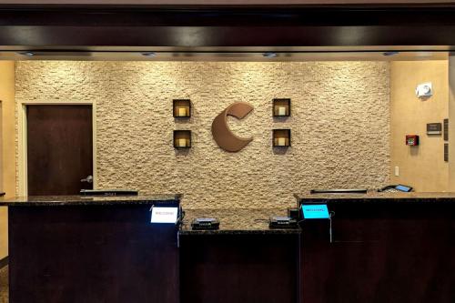 a hotel lobby with a sign on a wall at Comfort Inn & Suites Wadsworth in Wadsworth