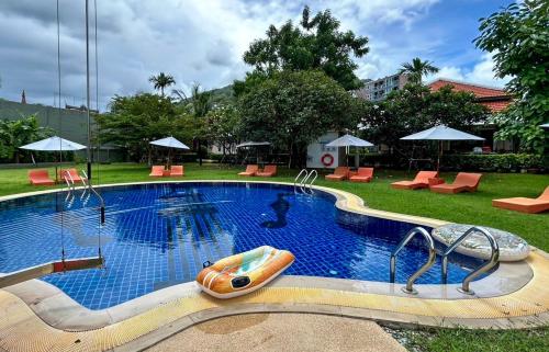 a large swimming pool with a raft in it at Kata Forte Resort in Kata Beach