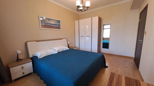 Ένα ή περισσότερα κρεβάτια σε δωμάτιο στο Cosy modern premium apartment in UB