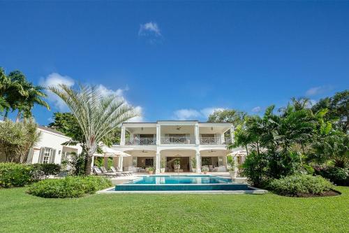 a large house with a swimming pool in the yard at One Westland Heights villa in Saint James
