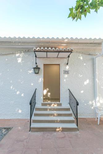 a stairway leading to a door on a building at Embrujo Andaluz Complejo Rural Órgiva in Órgiva