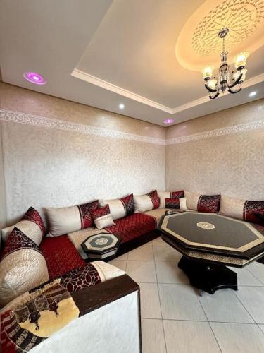 a living room with a couch and a table at Maison de vacances à Aglou in Zaouit Aglou