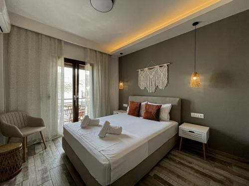 Postel nebo postele na pokoji v ubytování Hotel Eleni