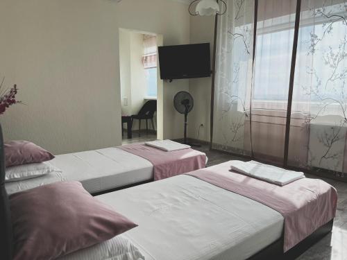 Кровать или кровати в номере Vip House Hotel