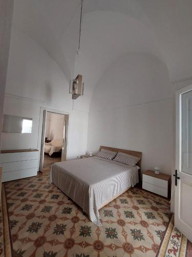 A bed or beds in a room at Casa Paola