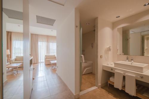 a bathroom with a sink and a toilet at TUI Blue Barut Andız - All Inclusive - Adults Only in Side
