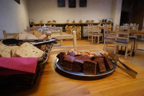 a plate of bread and cakes on a table at Romania in Karlovy Vary