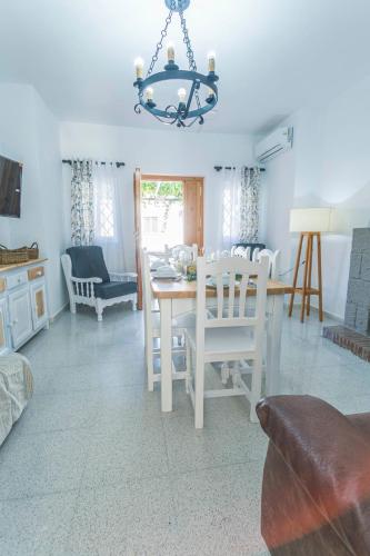a dining room with a table and chairs at Embrujo Andaluz Complejo Rural Órgiva in Órgiva