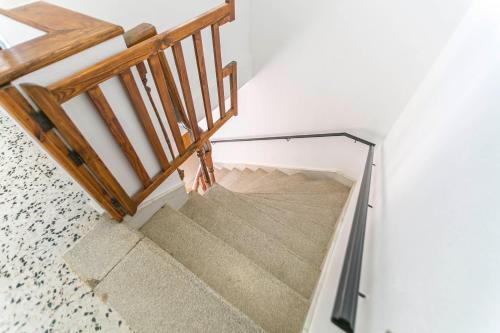 a stairway with a glass railing and a stair case at Embrujo Andaluz Complejo Rural Órgiva in Órgiva