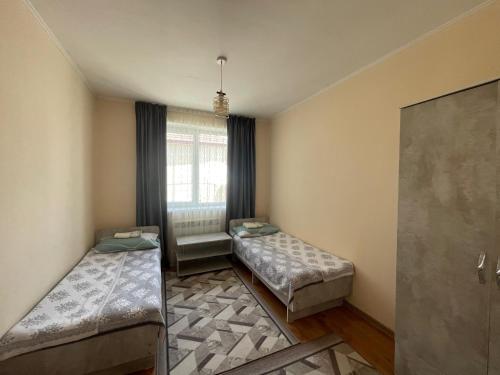 Llit o llits en una habitació de Dastan