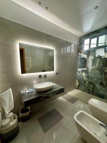 a bathroom with a sink and a mirror at Armonia dell'Etna in Santa Venerina