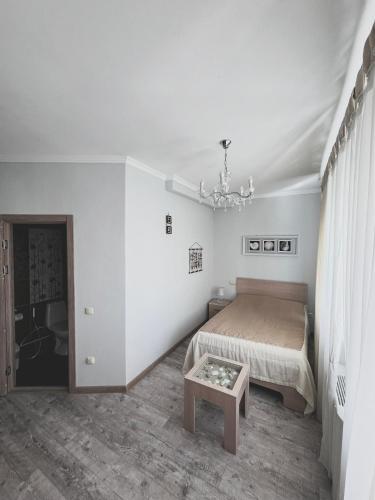 Кровать или кровати в номере Vip House Hotel