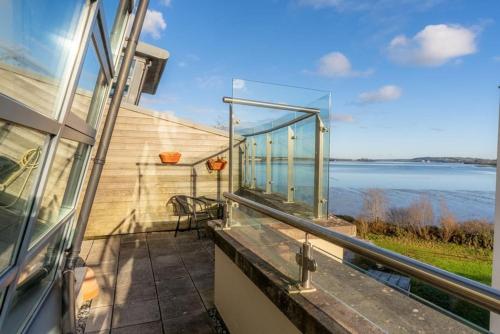 a balcony with a view of the water at Panoramic Two-bedroom Penthouse in Cork