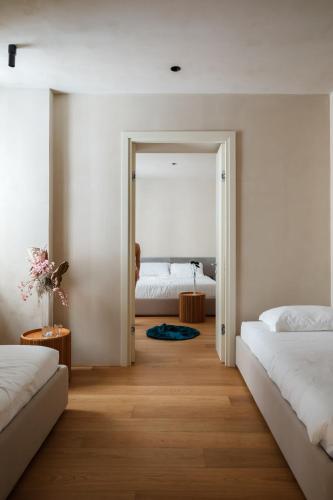 Postel nebo postele na pokoji v ubytování C10 Boutique Hotel