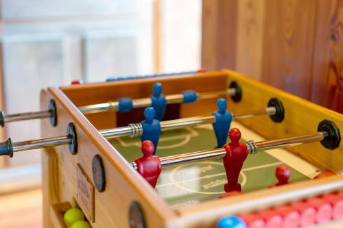 a close up of a wooden billiard table with balls at La Libellula in Scopello