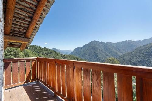 a balcony of a house with a view of mountains at La Libellula in Scopello