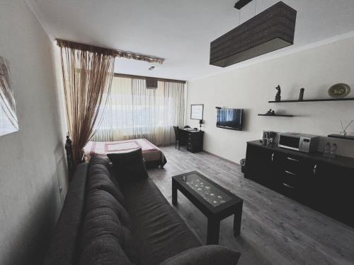 Телевизор и/или развлекательный центр в Vip House Hotel