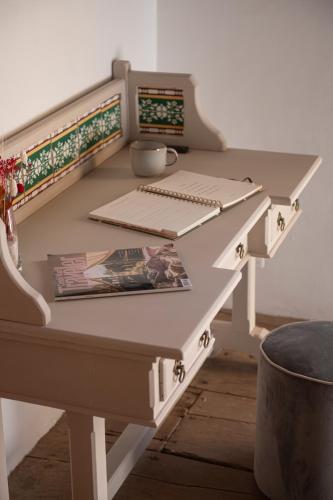 a white desk with a keyboard on top of it at La Casa de La Camelia in La Laguna