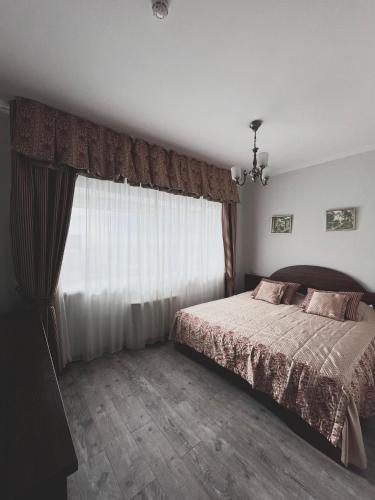 Кровать или кровати в номере Vip House Hotel