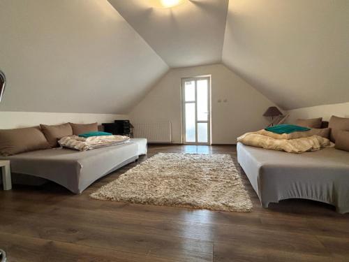 a living room with two beds and a couch at Fantastic camp in Piteşti