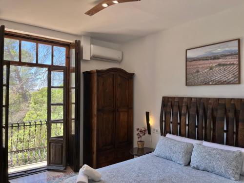 Postel nebo postele na pokoji v ubytování HOTEL BODEGA VERA DE ESTENAS