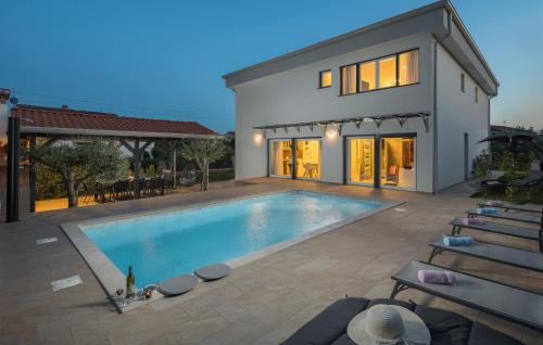 a swimming pool in the backyard of a house at Villa Mia in Frata