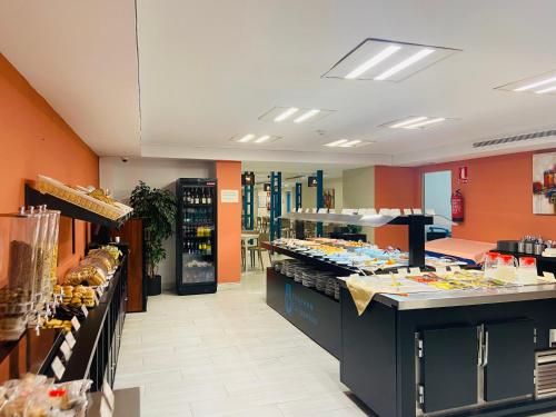 Kuchyň nebo kuchyňský kout v ubytování Hotel Los Jazmines