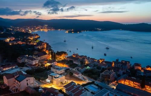 an aerial view of a city with a harbor at night at Gorgeous Home In Vis With Sauna in Vis