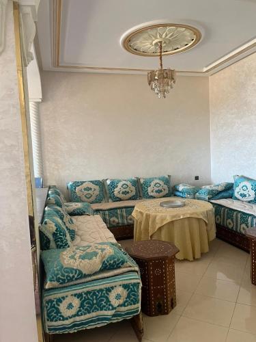 a living room with a couch and a table at 2 Chaaban 1, 1136 in Larache