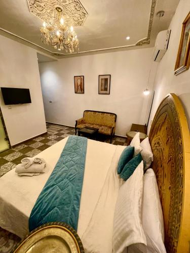 Postel nebo postele na pokoji v ubytování Palais Shazam & SPA
