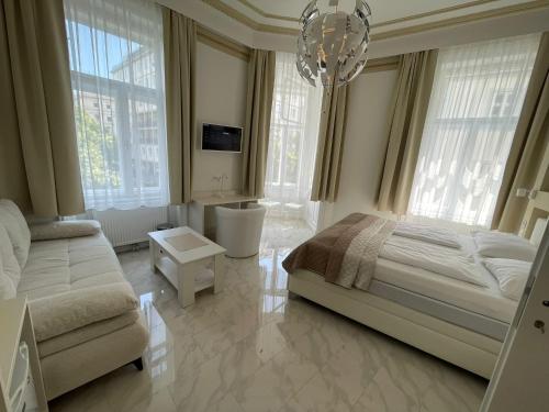 Posteľ alebo postele v izbe v ubytovaní CH-Hotel Luka