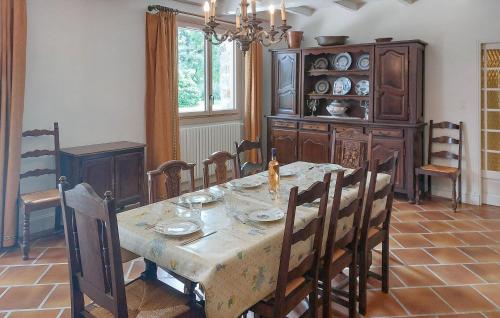 a dining room with a wooden table and chairs at Amazing Home In Saint-Thurien With Wifi in Saint-Thurien