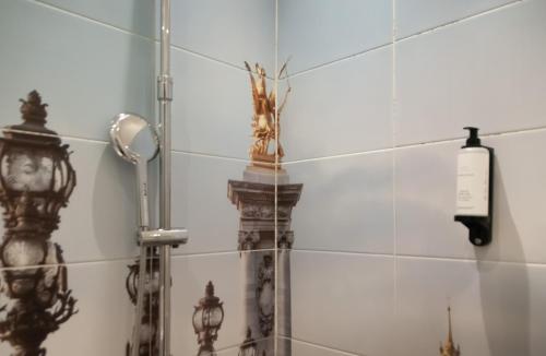 a shower in a bathroom with a mirror at H&ocirc;tel Petit Saint-Honor&eacute; in Paris