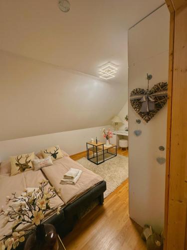 a bedroom with a bed in a room at Romantisches Wellness Chalet im steirischen Ursprung in Brodersdorf