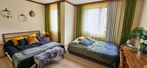 a bedroom with two beds and a window at Apartmanica Double room apartment with balcony 101-30 St Ivan Rilski SPA Resort Bansko in Bansko