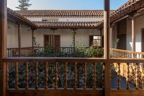 a balcony of a house with a fence at La Casa de La Camelia in La Laguna