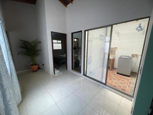 an empty room with a large window and a tile floor at Apartamento Relax in Medellín