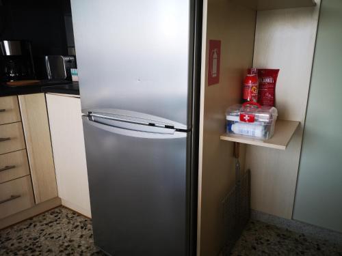 a stainless steel refrigerator in a kitchen at Sea View Apartment with 3 Bedrooms in Amfilochia in Amfilochía
