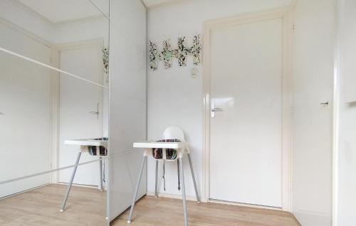a room with white walls and a mirror at Beautiful Home In Baarland With Wifi in Baarland