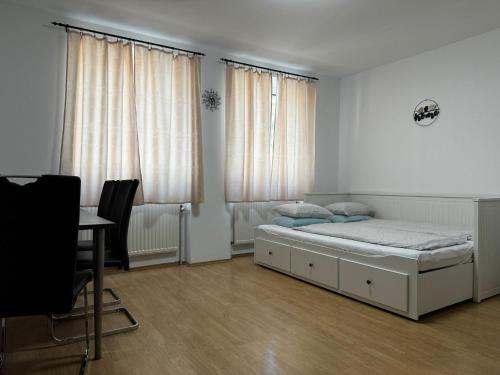 Postel nebo postele na pokoji v ubytování MCA Apartments
