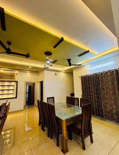 a dining room with a table and chairs at Diamond Villa Near Rajagiri Hospital in Alwaye